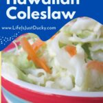 Coleslaw in striped bowl.