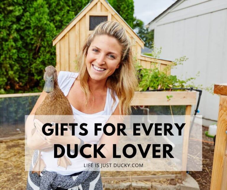 Woman holding duck and smiling.