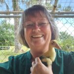 Mary St. Dennis with duckling